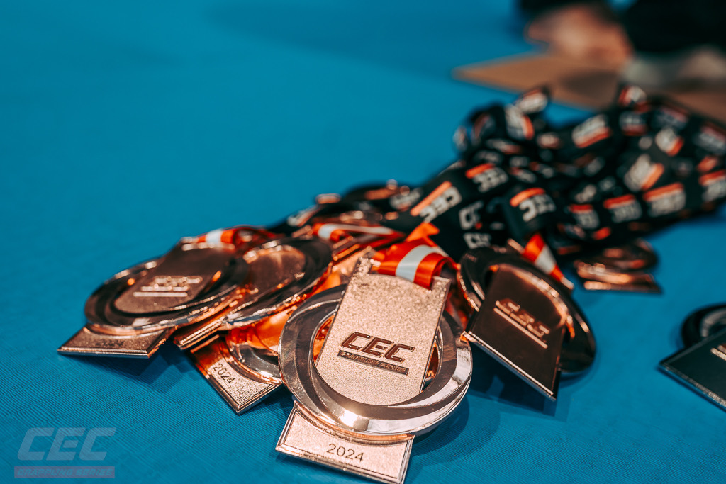 CEC medals engraved with the year, laid out before the awards