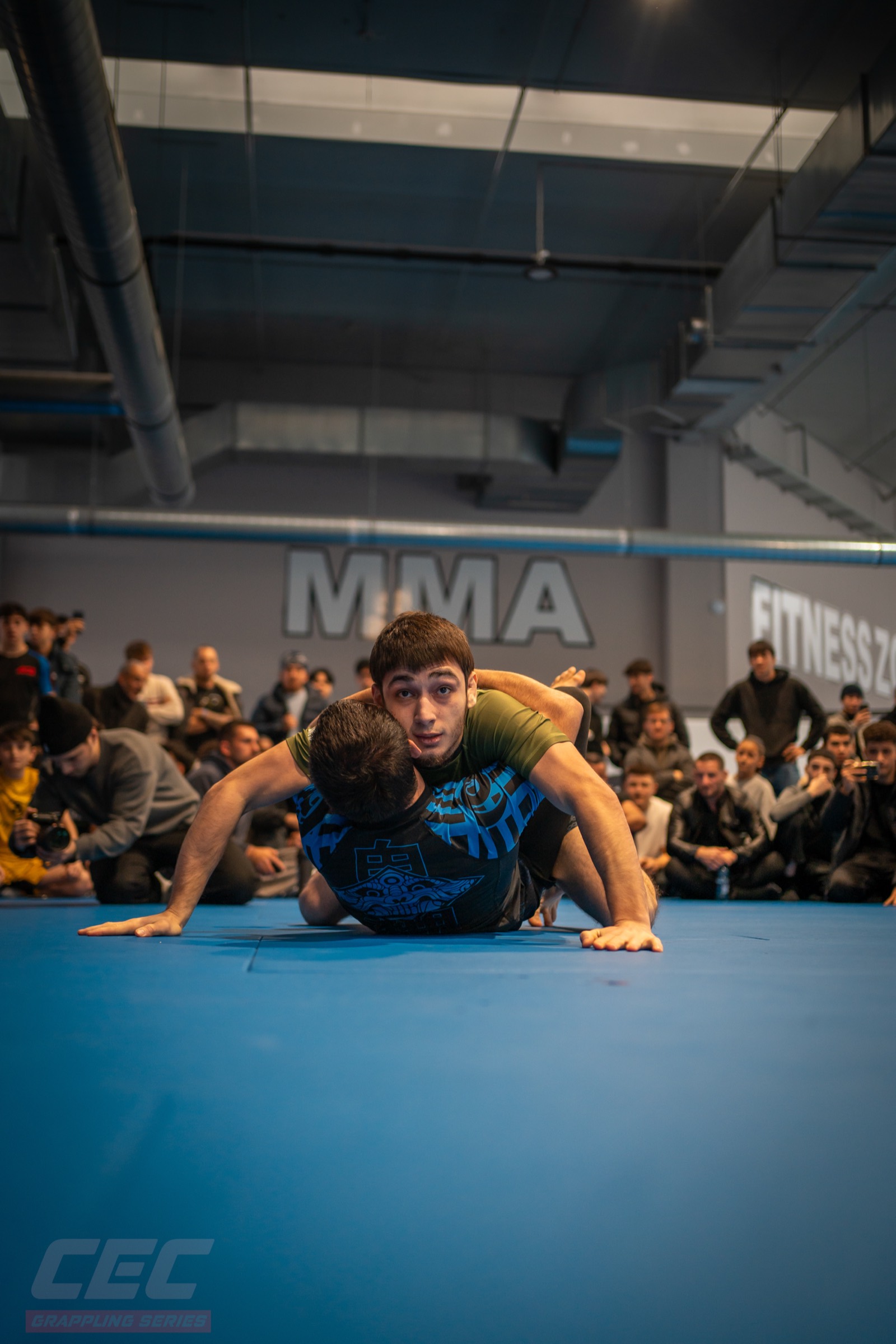 A match at Grappling Series 2 in front of a full room
